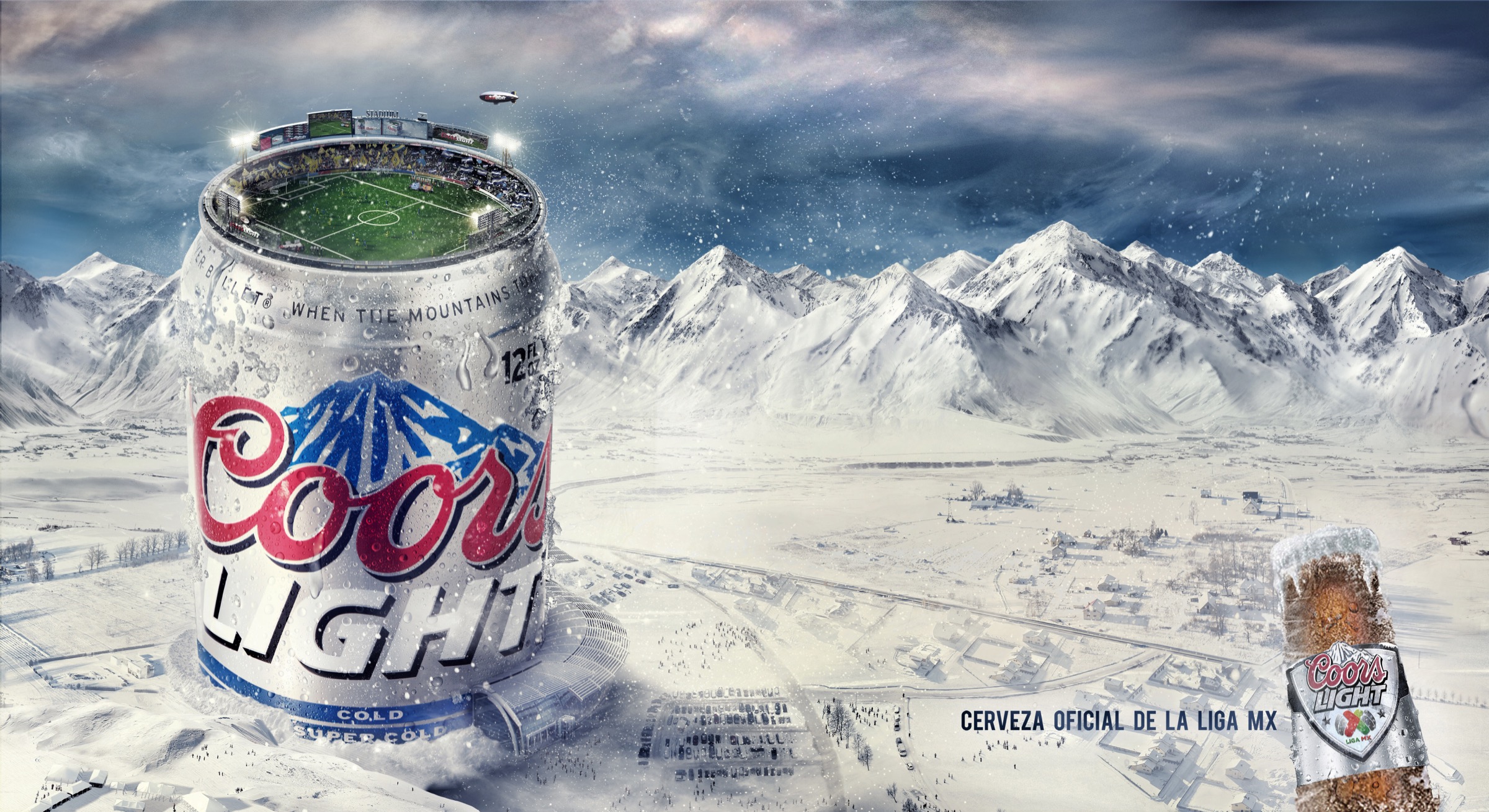 Coors Light Liga MX billboard with a soccer stadium built into the top of a Coors Light can in a snow-covered mountain range